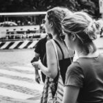 Walking Tours - Grayscale Photo of People Walking on The Street