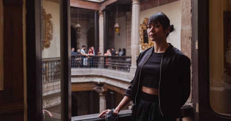 Historical Tours - Young Woman Posing in Historical Building 