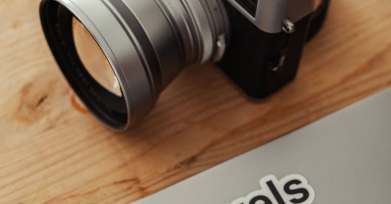 Photography Tours - A camera and a laptop with the word pixels on it
