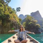 Adventure Tours - Photo of Woman Sitting on Boat Spreading Her Arms
