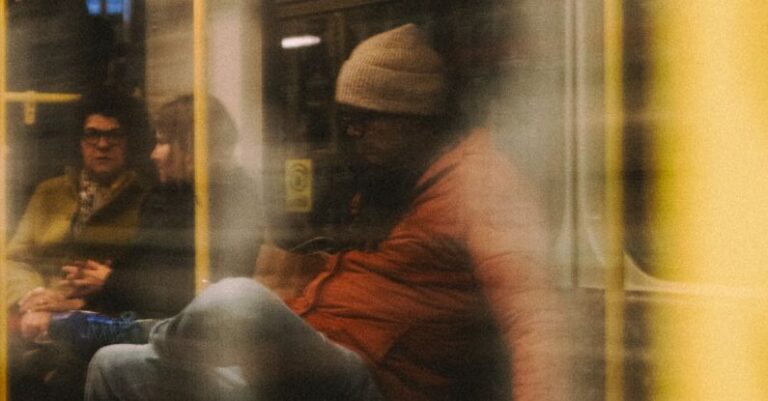 Subways - A blurry image of people on a subway train