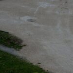 Walking Paths - Couple Walking on an Alley in a Park in the Rain