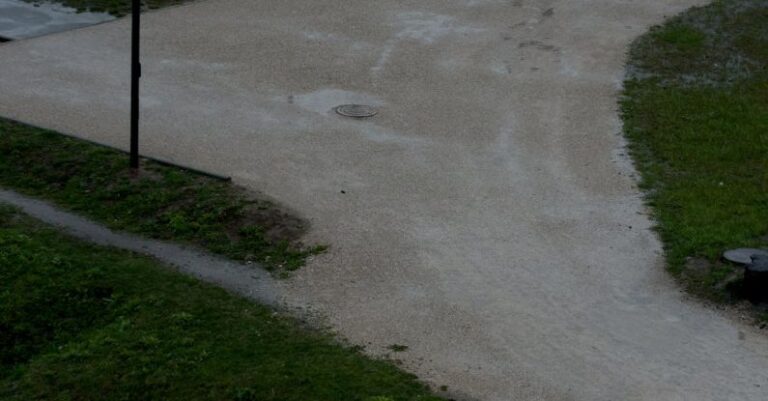 Walking Paths - Couple Walking on an Alley in a Park in the Rain