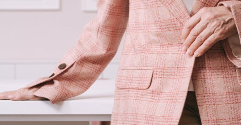 Family Attractions - Woman in Pink and White Plaid Blazer Sitting on Brown Wooden Chair