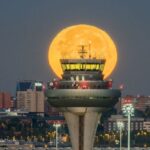 Late-Night Eateries - Full Moon behind Air Traffic Control at Madrid Airport