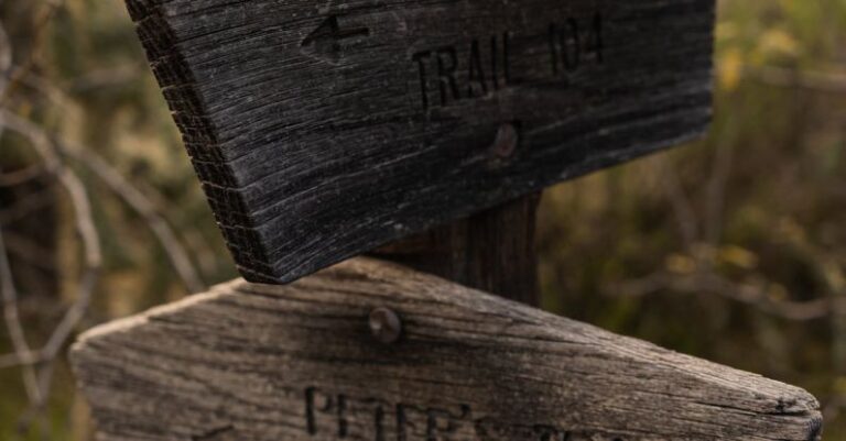 Hiking Trails - A wooden sign with two different directions on it