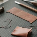 Handcrafted Goods - Tools and Leather Lying on a Desk in a Leather Crafting Workshop
