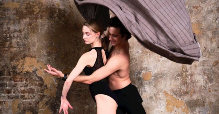 Emerging Artists - Two dancers in a studio pose with a blanket
