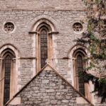 Memorials - A church with a tall tower and a tree