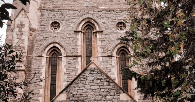 Memorials - A church with a tall tower and a tree